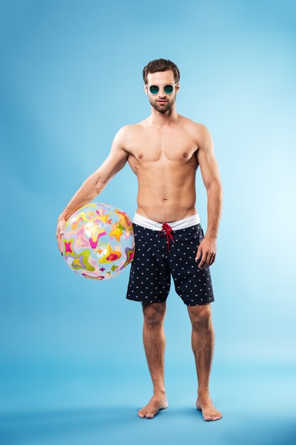 Full length portrait of a young man in summer wear