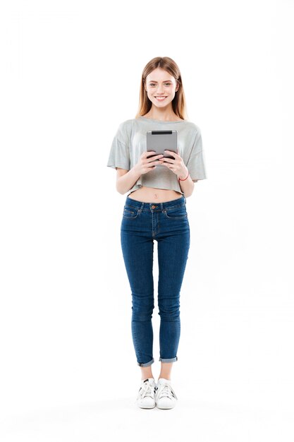 Full-length shot of woman with tablet