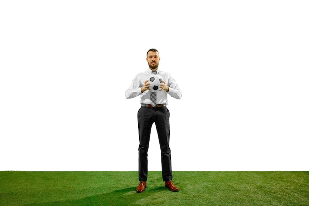 Free photo full length shot of a young businessman playing football isolated on white wall