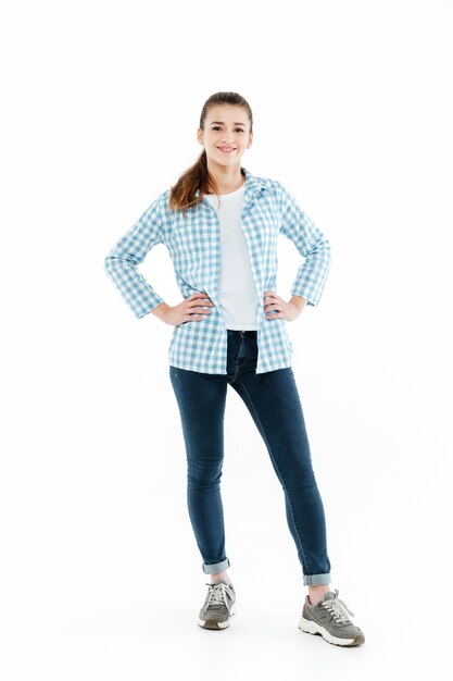 Full-length shot of young young woman posing at camera