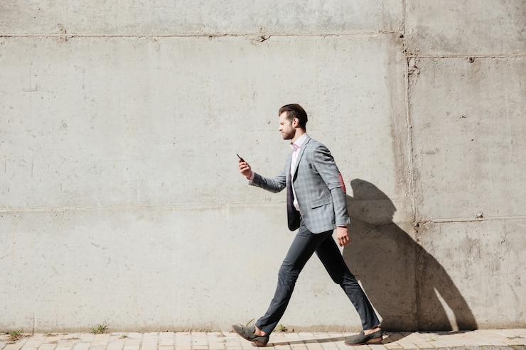 Free Photo full length side view portrait of a man in jacket