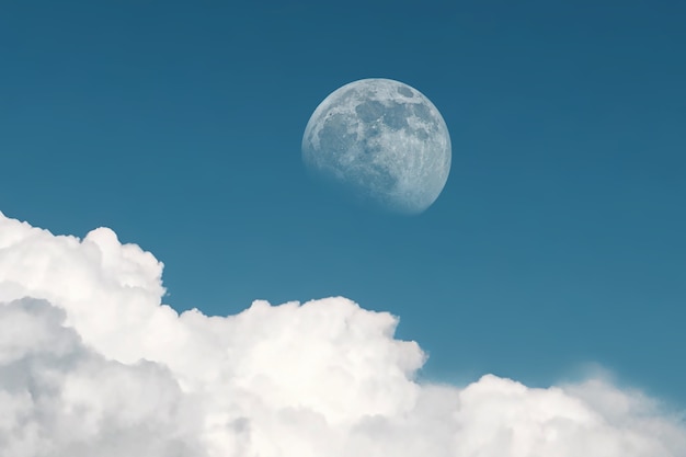 Free photo full moon appears during daytime in late afternoon