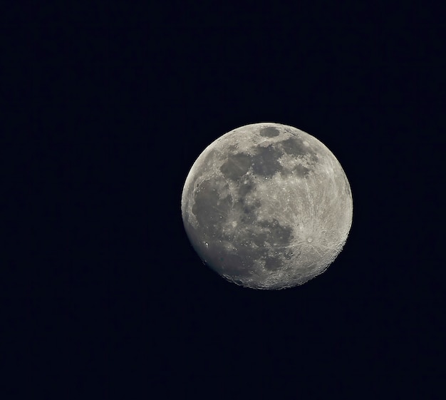 Full moon in dark night sky