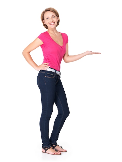 Free photo full portrait of adult happy woman with presentation gesture on white