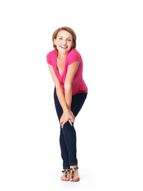 Full portrait of the beautiful happy woman stands on white