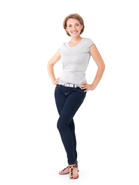 Full portrait of the beautiful happy woman stands on white