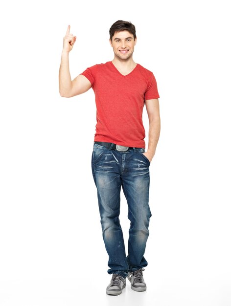 Full portrait of the  happy man with good idea sign in casuals isolated on white wall.