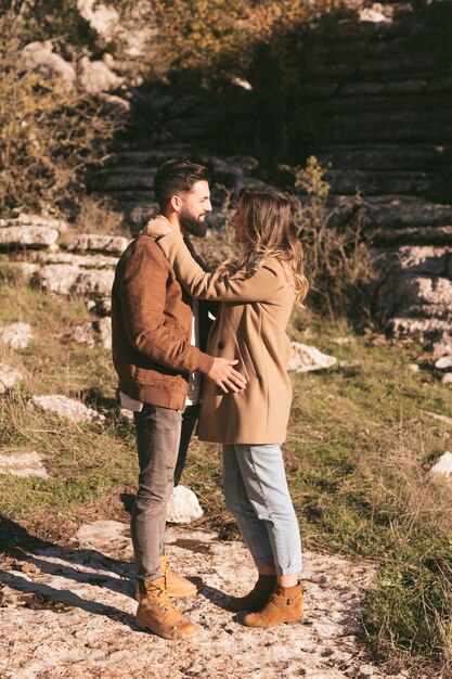 Full shoot young couple embracing in nature