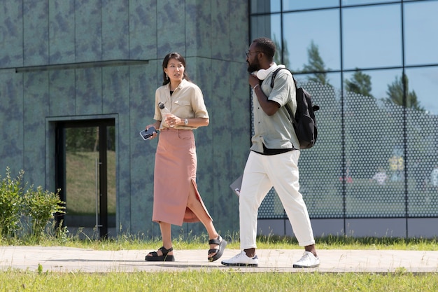 Full shot adults walking together outdoors