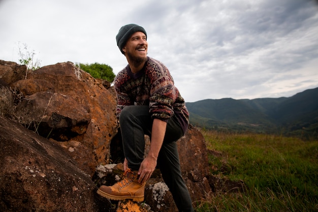 Full shot adventurous man bivouacking