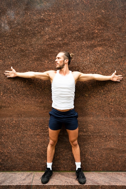 Free photo full shot of athlete stretching