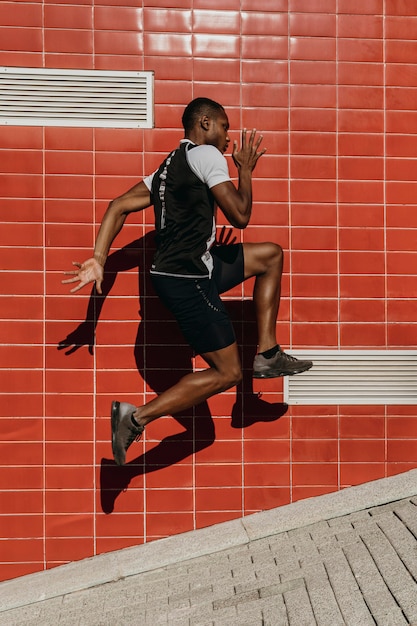 Full shot athletic man jumping