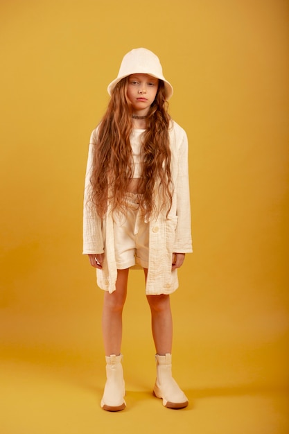 Full shot beautiful girl posing with hat