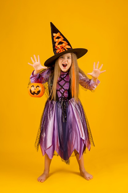 Free photo full shot of beautiful girl with witch costume