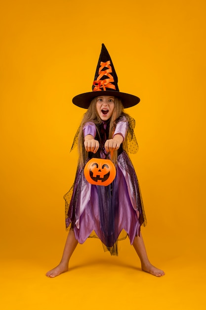 Free photo full shot of beautiful girl with witch costume