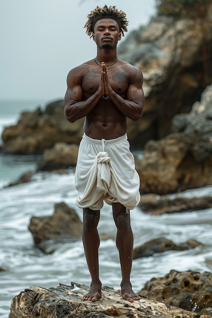 Бесплатное фото Чернокожий мужчина практикует йогу.