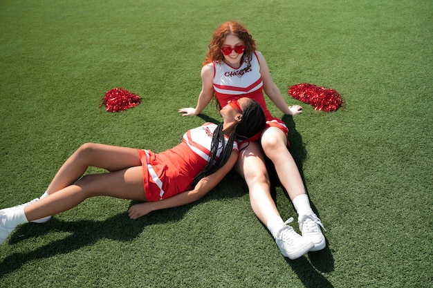 Full shot cheerleaders on grass