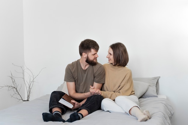 Full shot christian couple with bible