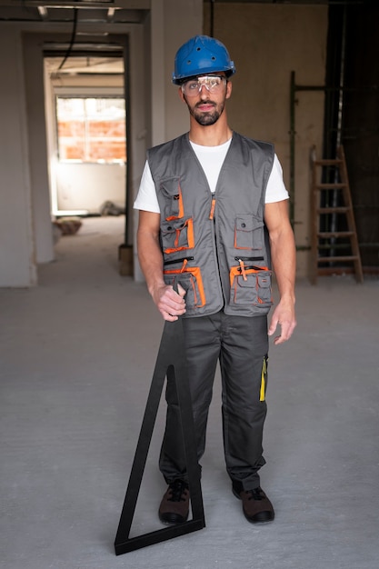 Full shot construction worker wearing helmet