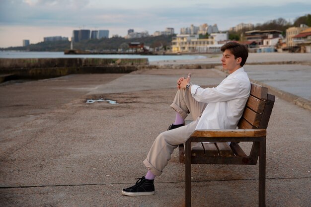 Full shot contemplative man at the seaside