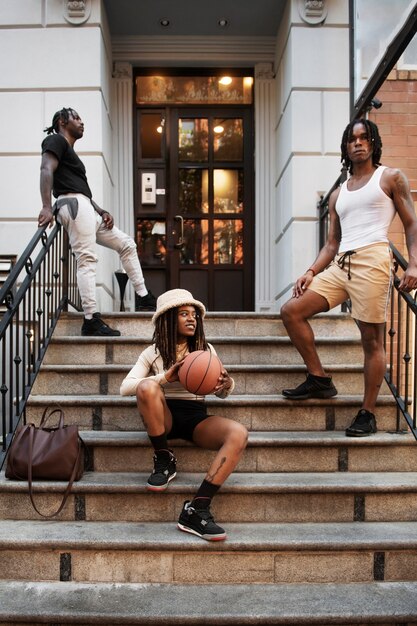 Full shot cool friends posing on stairs