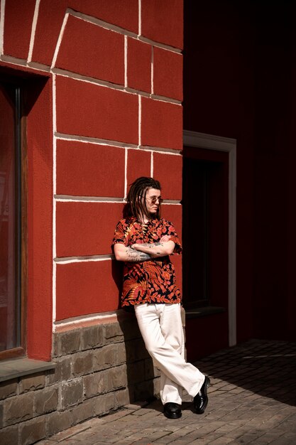 Full shot cool man posing outdoors