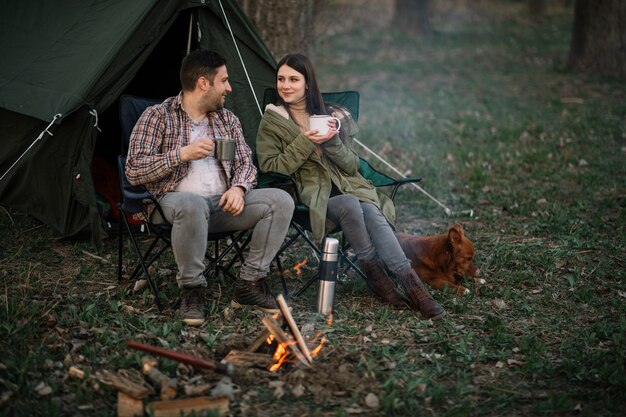 Full shot couple on chairs