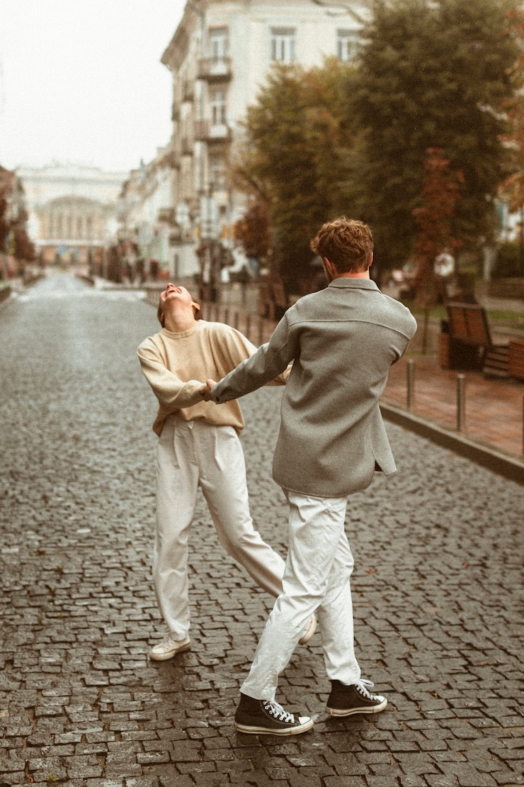 Free Photo full shot couple dancing outdoors