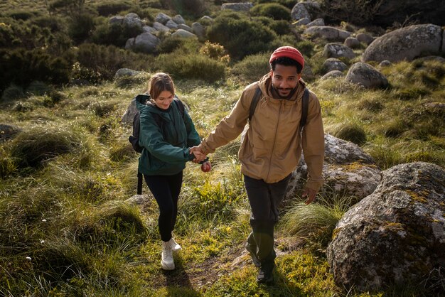 Full shot couple on a hiking trip