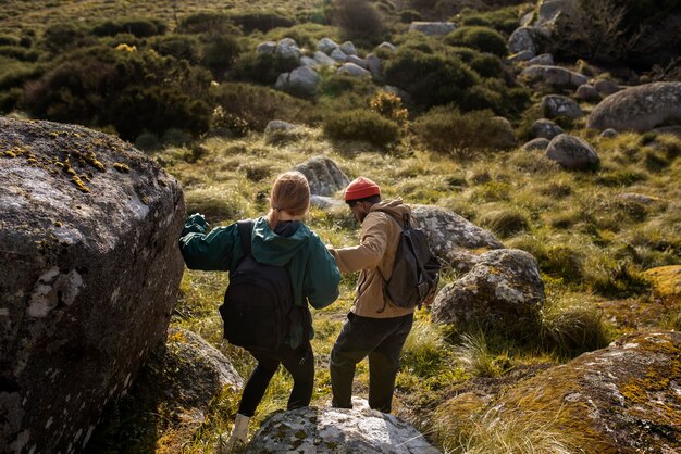 Full shot couple on a hiking trip