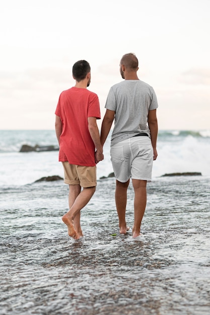 Full shot couple holding hands