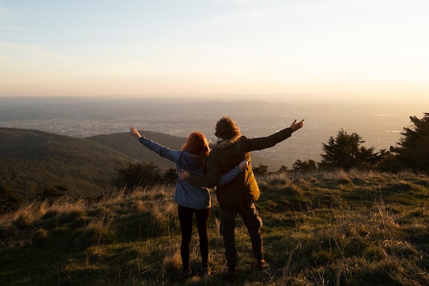 Full shot couple in nature