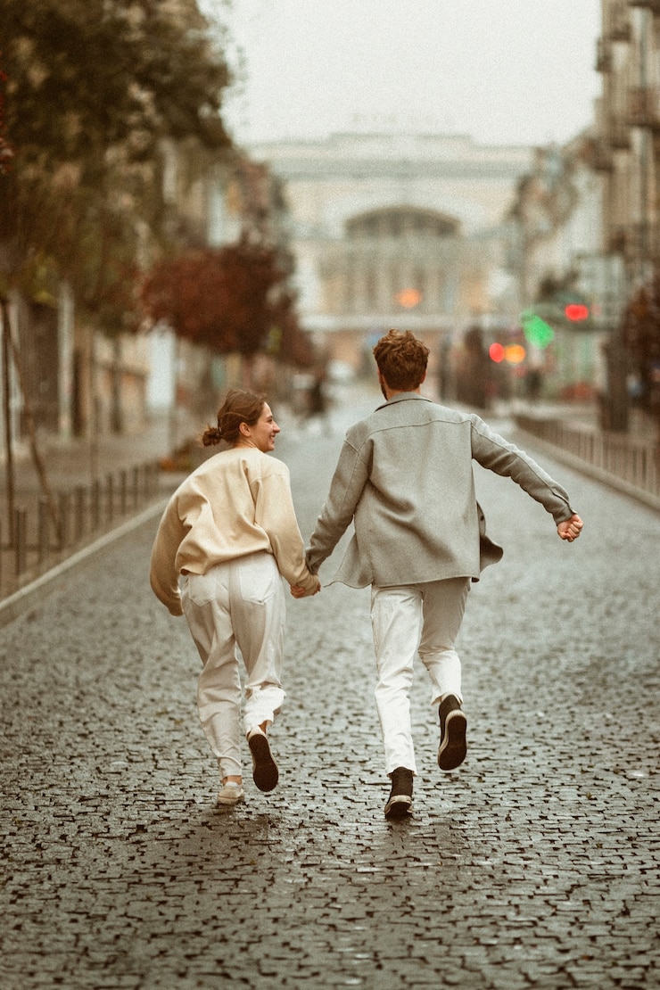 Free Photo full shot couple running outdoors