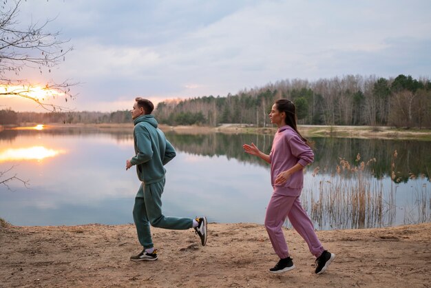 Full shot couple running together