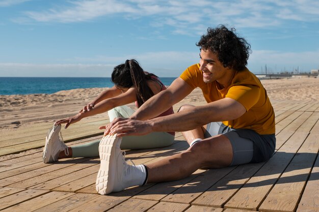 Full shot couple training outdoors