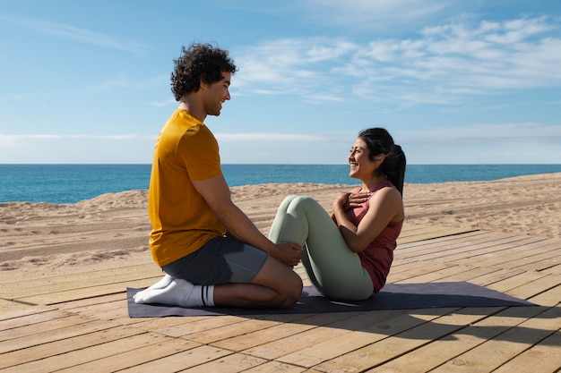 Full shot couple training outdoors