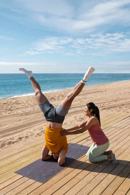 Full shot couple training together outdoors