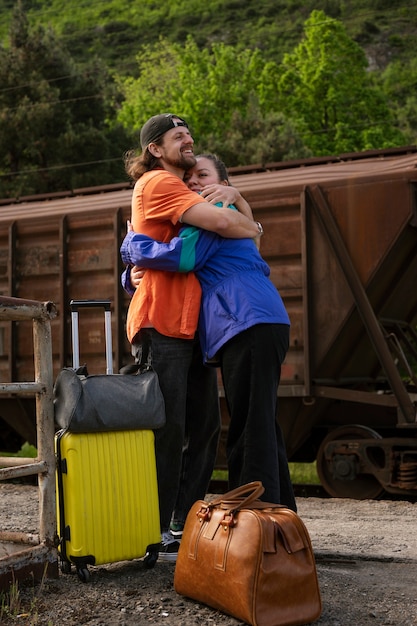 Full shot couple traveling together