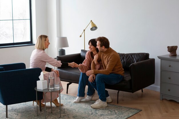 full shot couple undergoing therapy