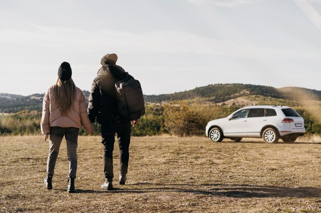 Full shot couple walking together