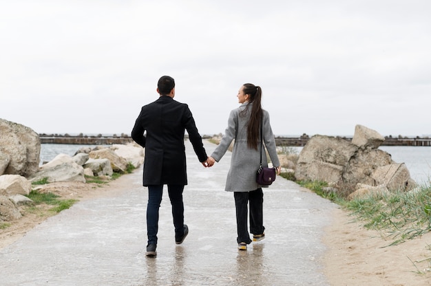 Full shot couple walking together