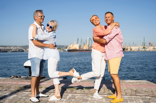 Full shot couples posing together