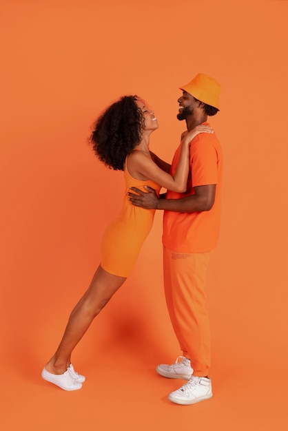 Full shot cute couple posing together in studio