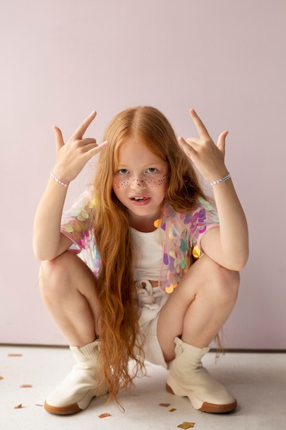 Full shot cute girl with ginger hair posing