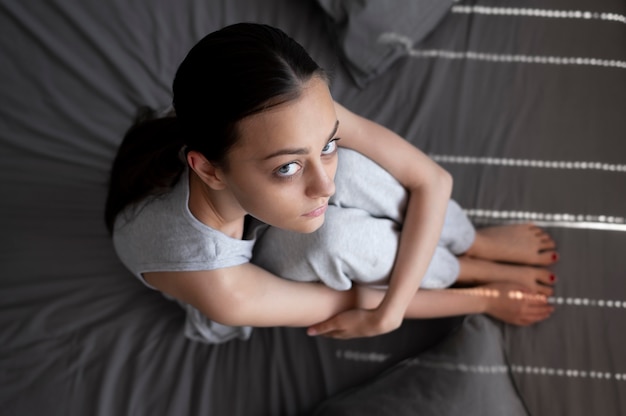 Full shot depressed woman