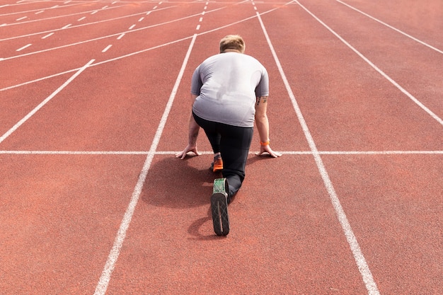 Full shot disabled athlete ready to run