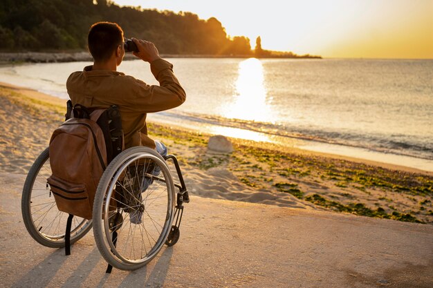 Full shot disabled man with binoculars