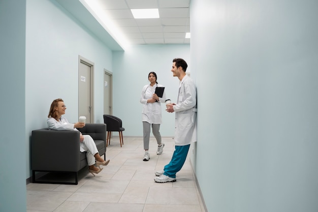 Full shot doctors on hallway