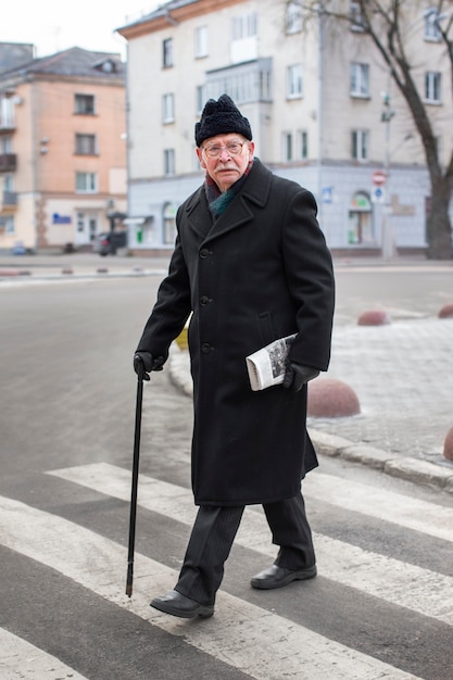 Full shot elderly man taking a stroll