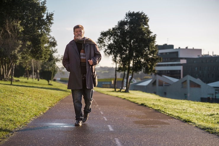 Free Photo full shot elderly man taking a stroll